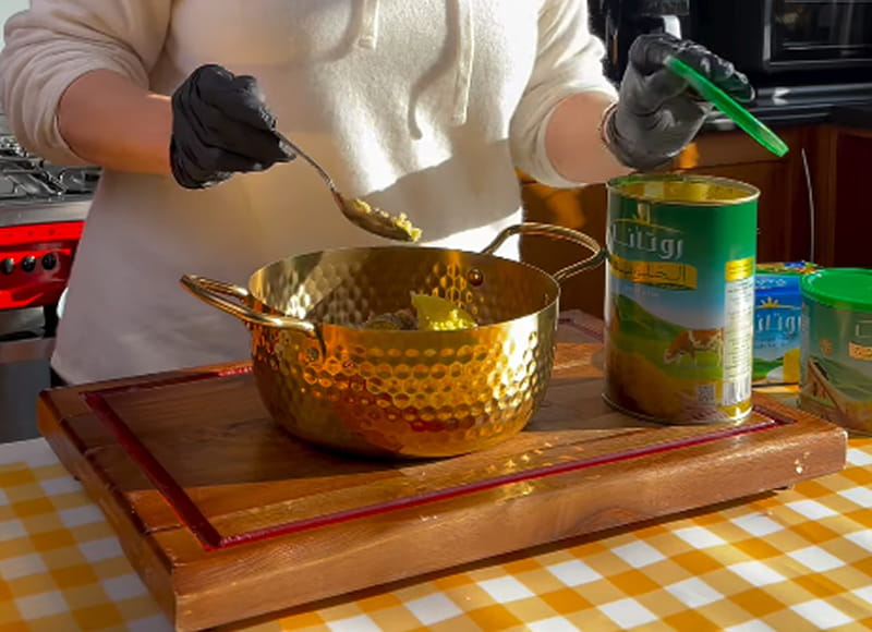 Golden ghee in a ceramic dish